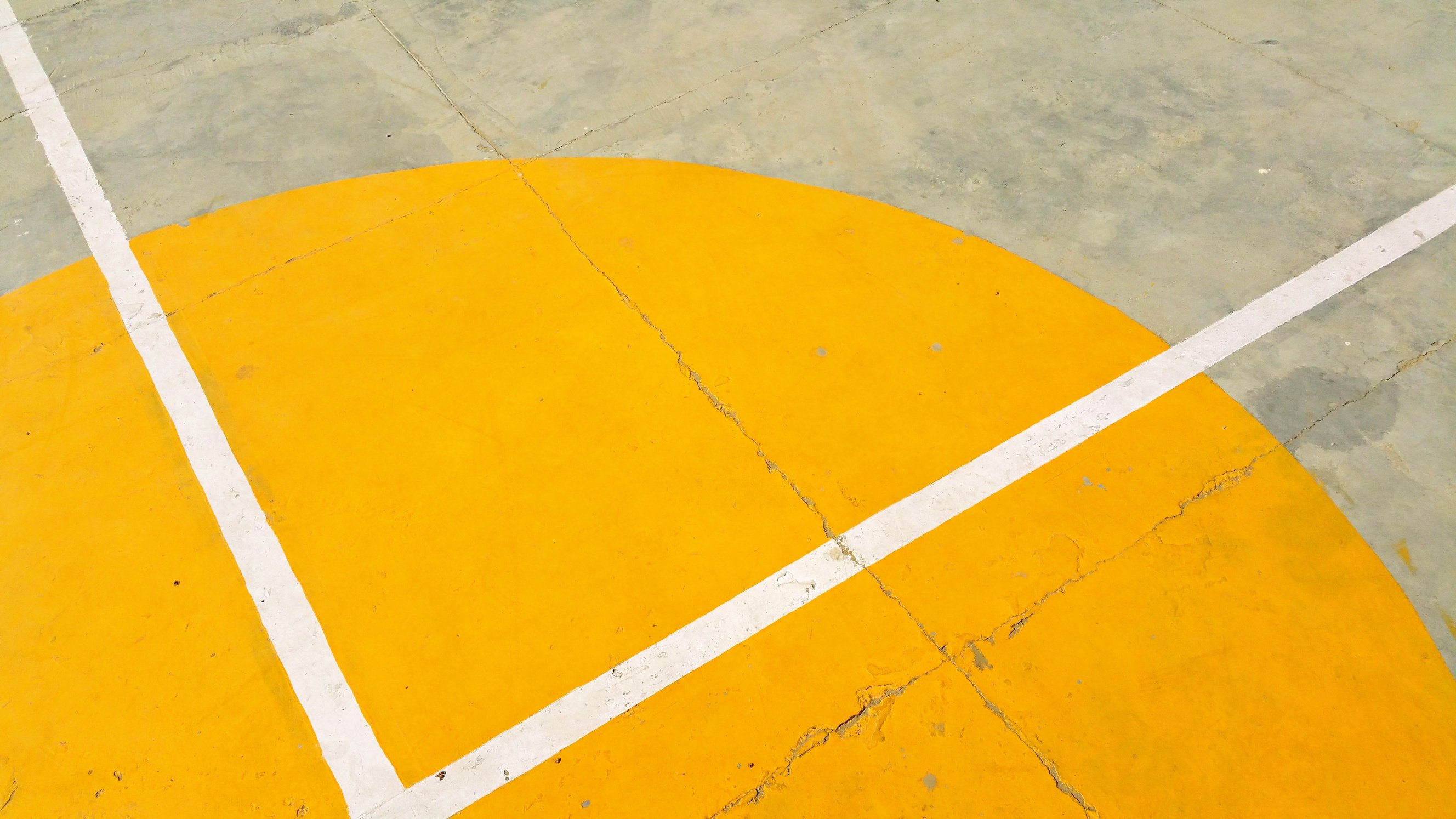 Gray Concrete Pavement With Yellow and White Paint